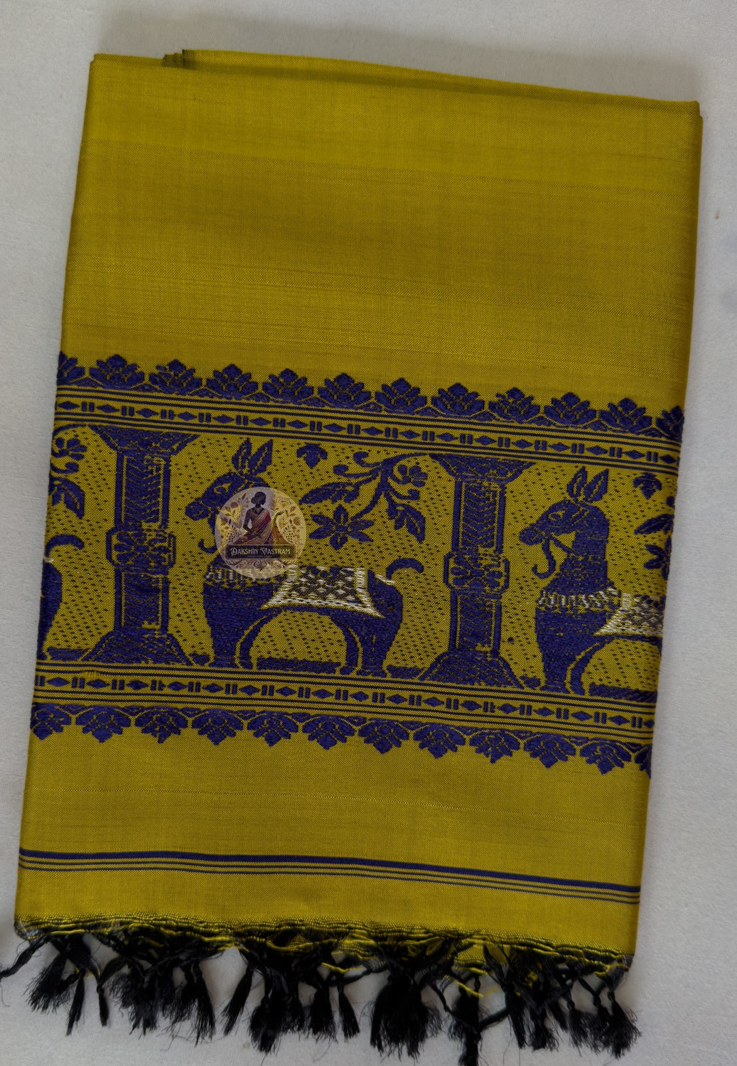 End panel detail of Baluchari pure silk stole – hand-knotted black silk tassels with indigo woven border featuring mythological motifs, authentic Bengal handloom – Dakshin Vastram