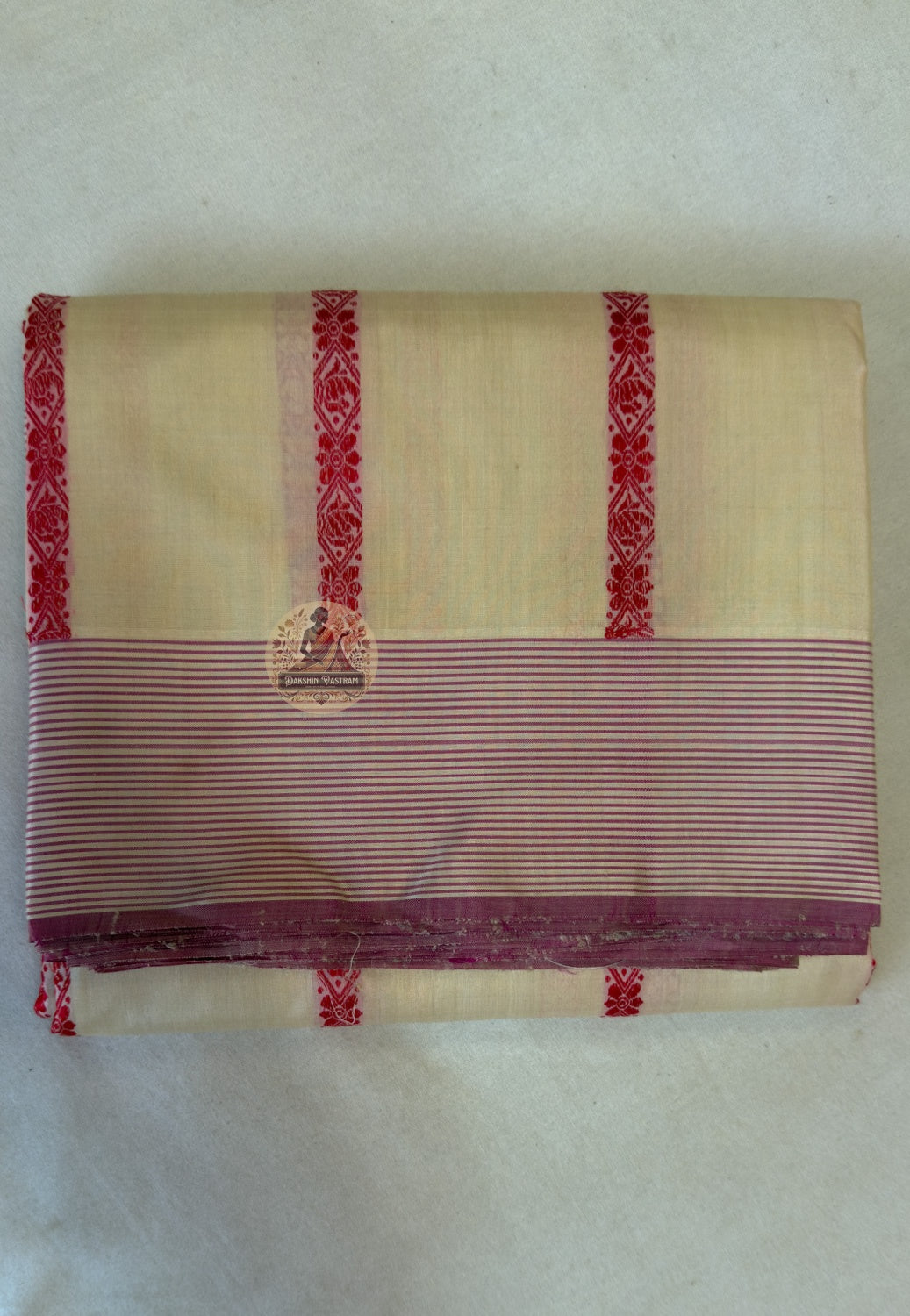 Full flat lay of Bhagalpur pit loom Tussar silk saree showing natural earthy gold body, woven tribal-inspired border and wild silk texture — Dakshin Vastram