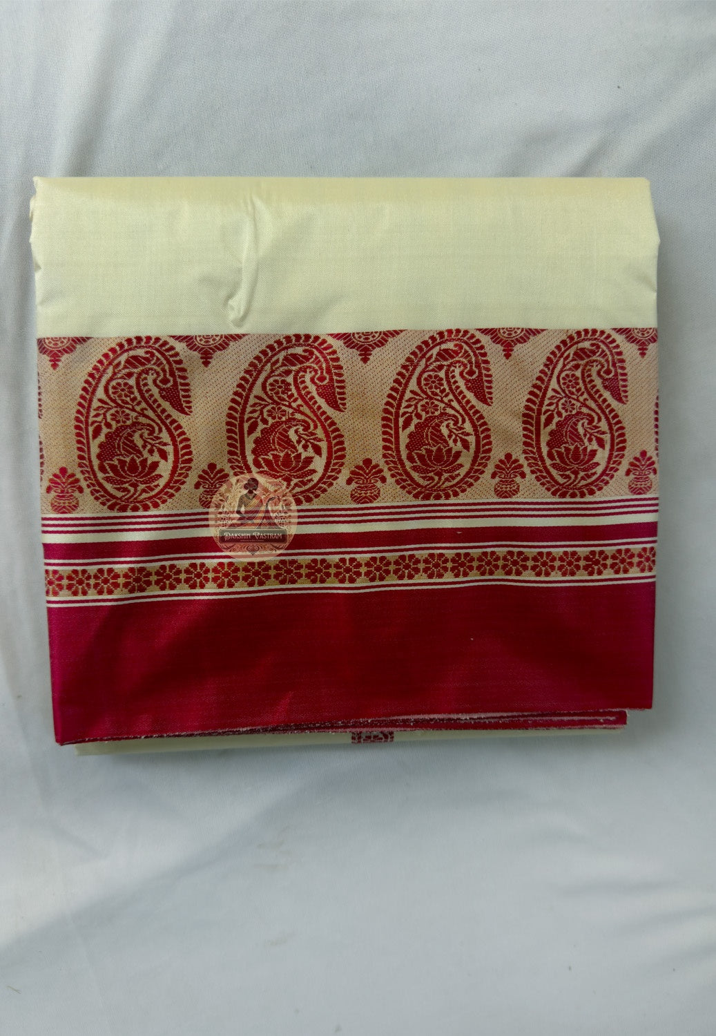 Close-up of pallu of Bishnupur Garad ivory puja silk saree showing traditional woven Bengal border and motif detail by Bankura handloom weavers