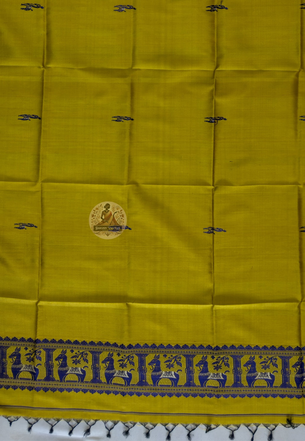 Close-up of pure silk fabric of Baluchari stole – warm mustard weave with delicate hand-woven buti motifs, naturally lustrous handloom silk from Bishnupur, West Bengal
