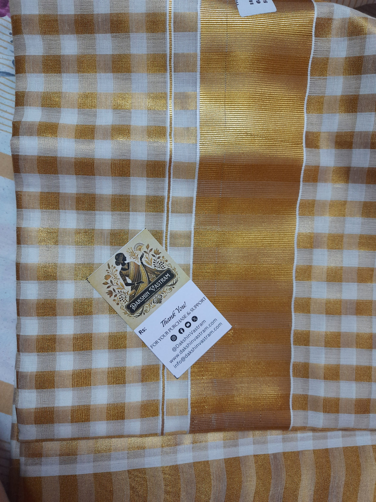 Rear view of Handloom Tissue Checked Saree highlighting its soft texture and refined design