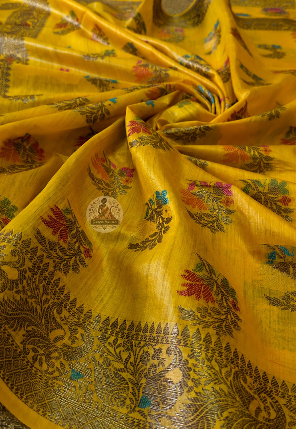 Close-up of Banarasi zari weave on Muga Tussar Saree showing handwoven gold motifs and fine silk texture