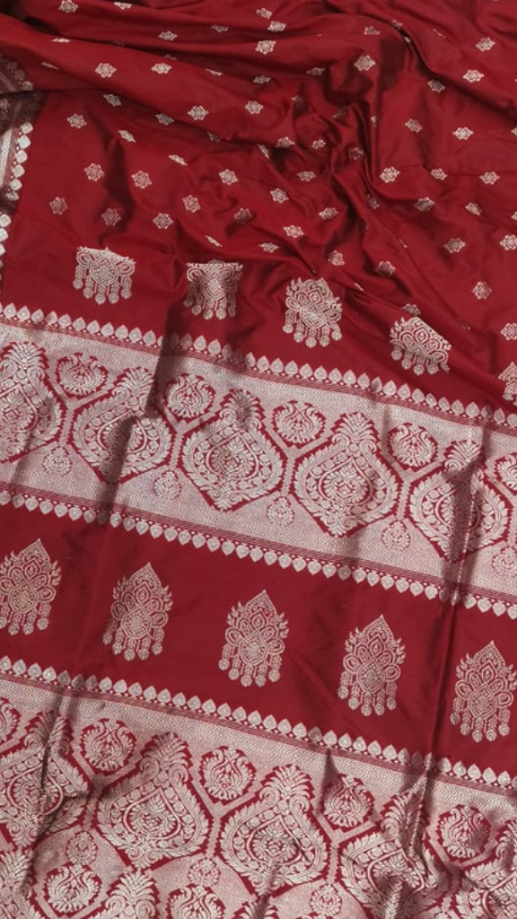 Side view of Assam Zari Silk Saree showing the graceful drape and fluid fall of pure mulberry silk with gold zari border catching the light