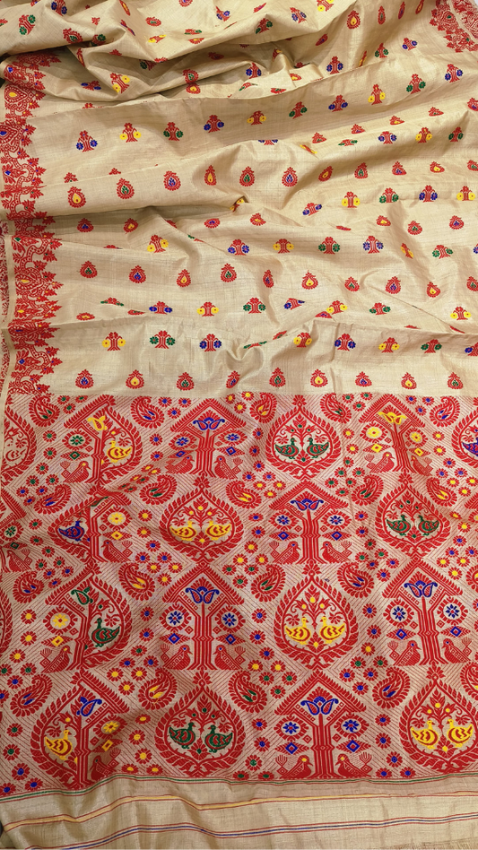 Close-up of Sualkuchi handloom Muga silk showing grandmother's traditional motif woven in naturally golden thread — Assam craftsmanship