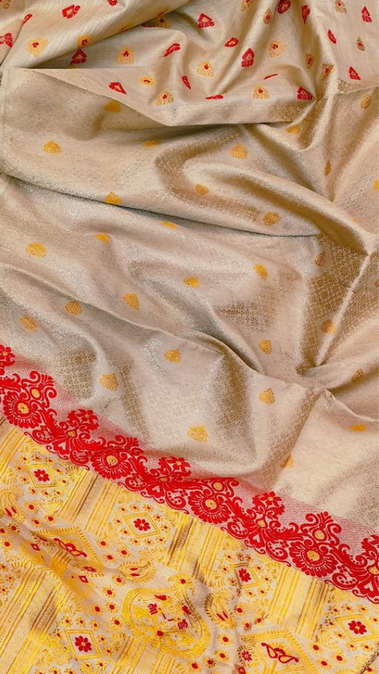 Close-up of Muga silk weave showing natural golden lustre and dense handloom texture — Assam heritage craft