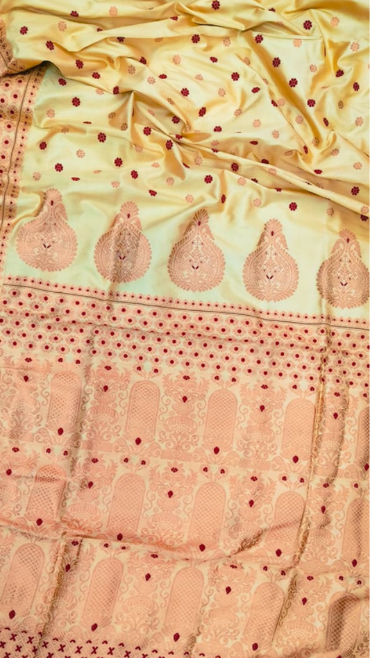 Side view of Assam Copper Zari Silk Saree showing the elegant drape and fluid fall of pure mulberry silk with copper metallic border catching the light
