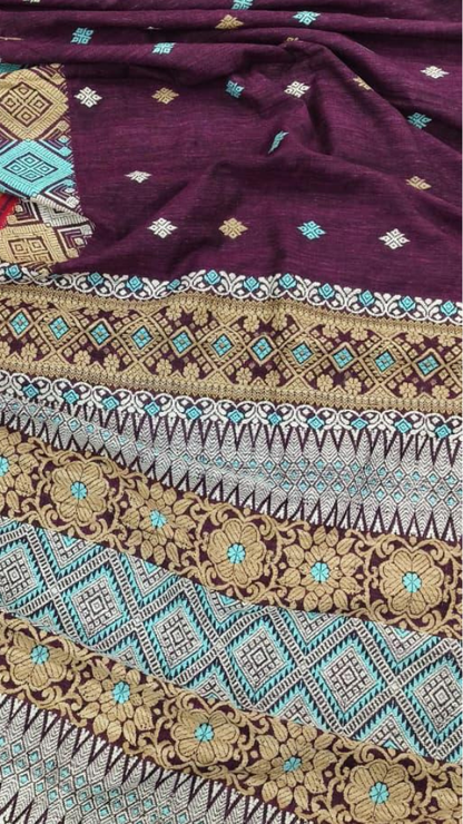 Flat lay of handwoven pure Eri silk saree with blouse piece, natural matte texture, traditional Assamese pit loom weave