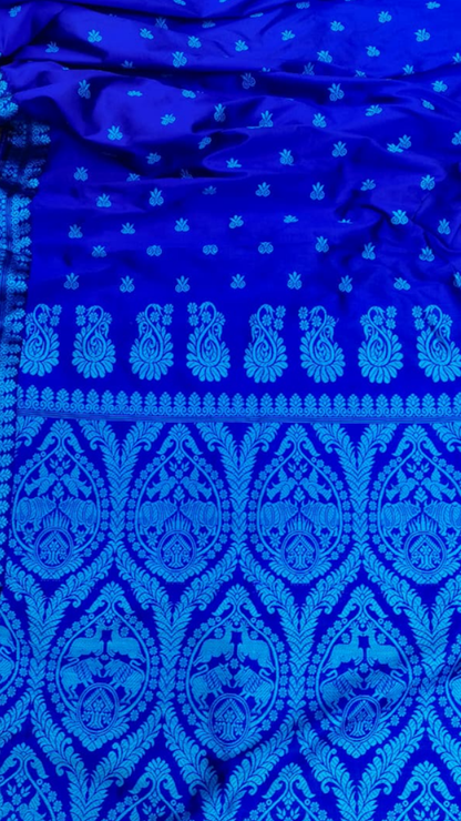Rear view of Assam Mulberry Silk Saree displaying the ornate thread work pallu with traditional Assamese motifs and natural silk lustre