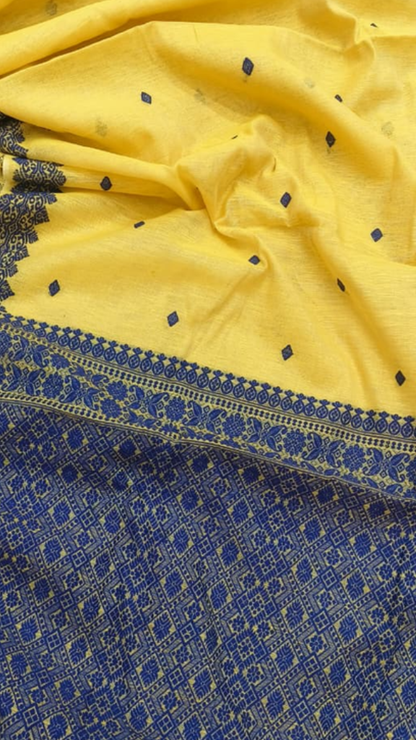 Flat lay of Eri silk saree with Mulberry silk border, showcasing handloom weave and natural silk sheen