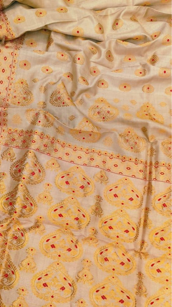 Rear view of handloom Muga silk saree displaying naturally golden Assam silk fall and restrained handloom border, silk that exists nowhere else on earth