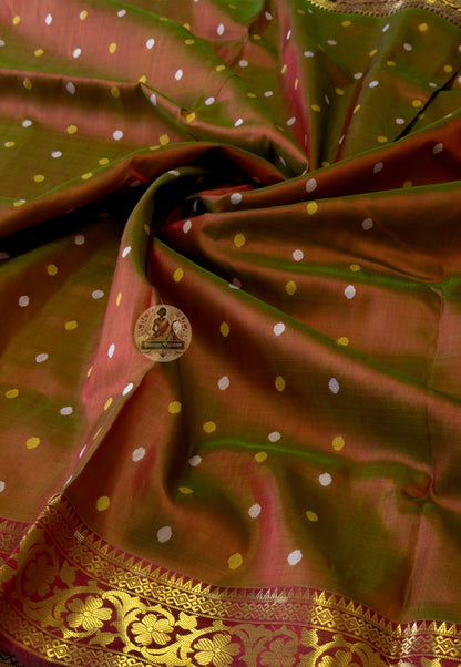 Close-up of Bishnupuri handwoven katan silk weave – natural mulberry silk lustre blazing with cultural pride, intricate Bengal temple motifs woven permanently into pure silk fabric