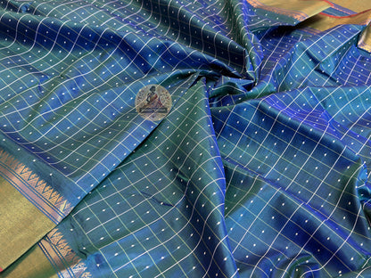 Close-up of Bishnupur Silk Bindu Buti saree – woven dot-and-sprig motifs integrated directly into pure silk threads by master craftsmen in Bishnupur, West Bengal