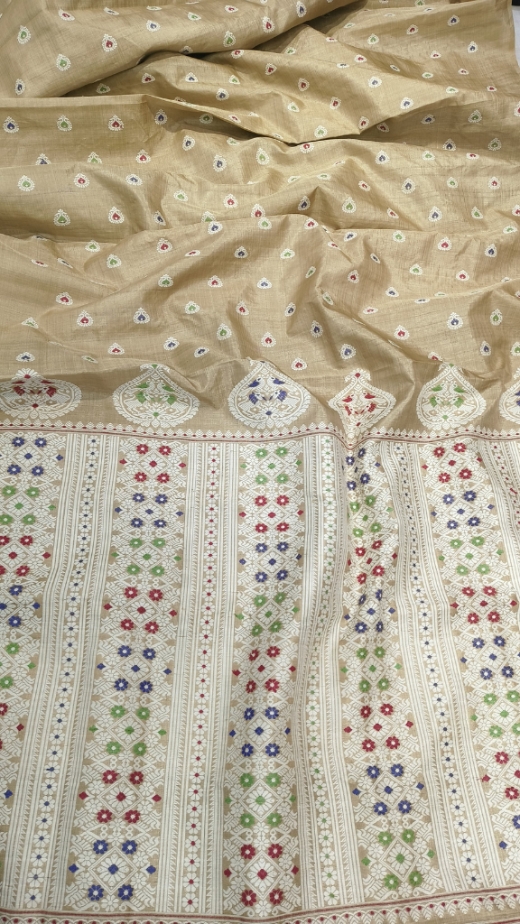 Muga silk heirloom saree from Assam in gift-ready packaging, natural golden body with hand-woven border — the gift that outlives the moment, Dakshin Vastram