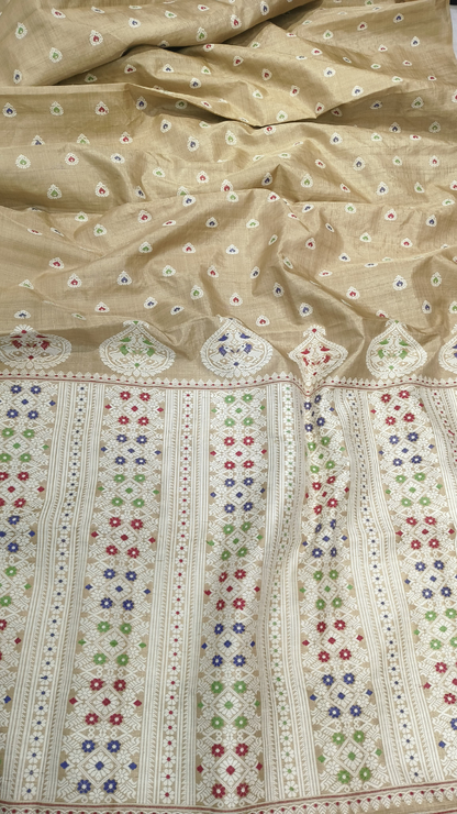 Muga silk heirloom saree from Assam in gift-ready packaging, natural golden body with hand-woven border — the gift that outlives the moment, Dakshin Vastram