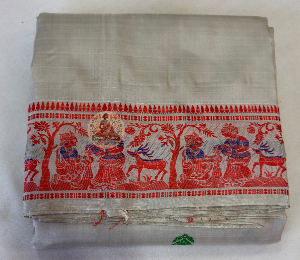 Side profile of woman wearing handwoven Baluchari Silk saree, saree drape showing movement and natural lustre of Mulberry Silk