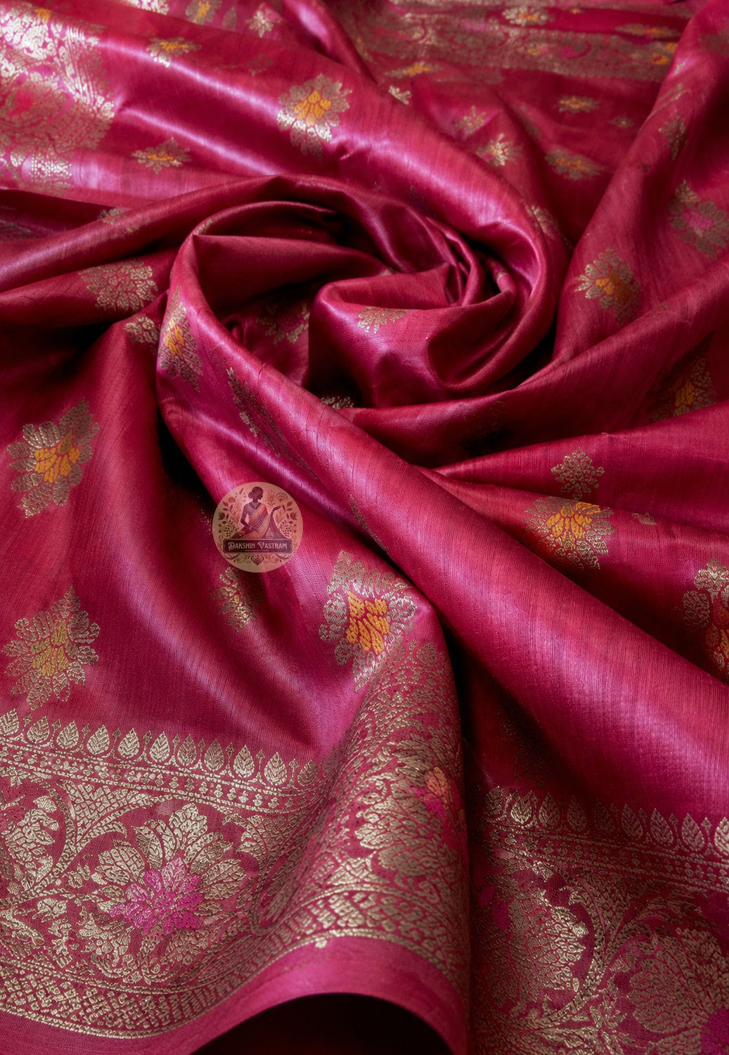 Close-up of natural Muga Tussar silk texture of Banarasi Saree showing dense handwoven weave and warm golden sheen of wild silk