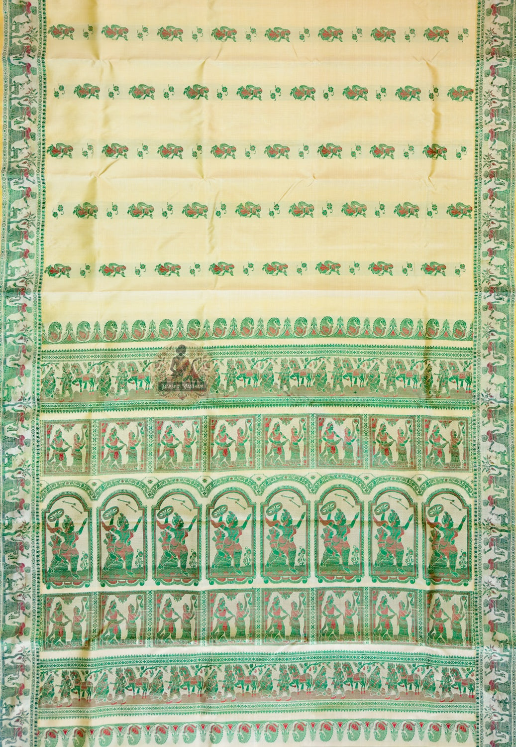 Macro close-up of individual hand-woven mythological motif on Beige Baluchari Silk Saree by Dakshin Vastram, each figure woven thread by thread against the beige silk canvas