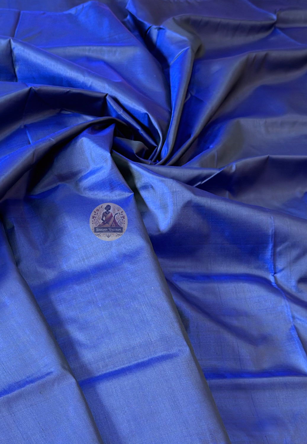Pure silk than saree close-up showing fluid drape and lustrous handloom texture