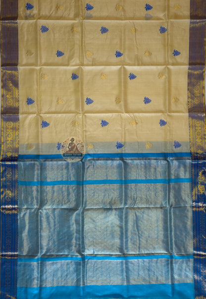 Flat lay of handwoven Tussar silk slub saree from Jharkhand showing natural earthy gold body, traditional border and wild silk texture detail — Dakshin Vastram