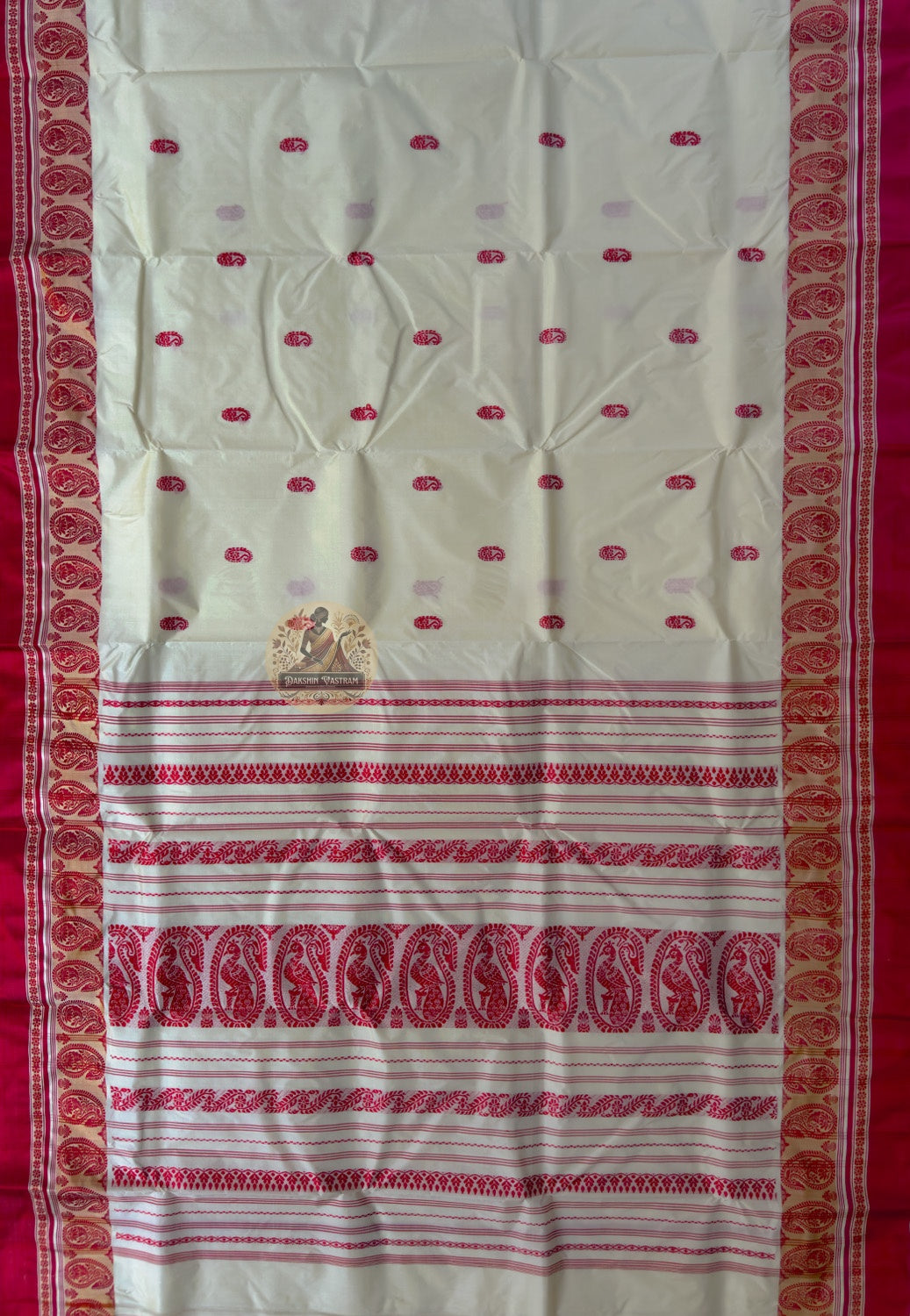 Close-up of Bishnupur Garad silk saree weave showing natural ivory mulberry silk texture and subtle buti motifs discernible in natural light