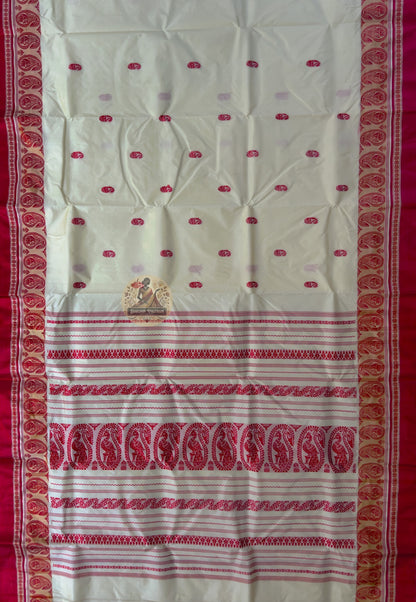 Close-up of Bishnupur Garad silk saree weave showing natural ivory mulberry silk texture and subtle buti motifs discernible in natural light