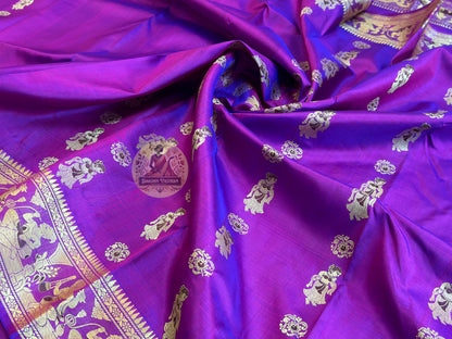 Bridal Baluchari silk saree in deep carmine red with woven Ramayana figures and rich gold zari temple border