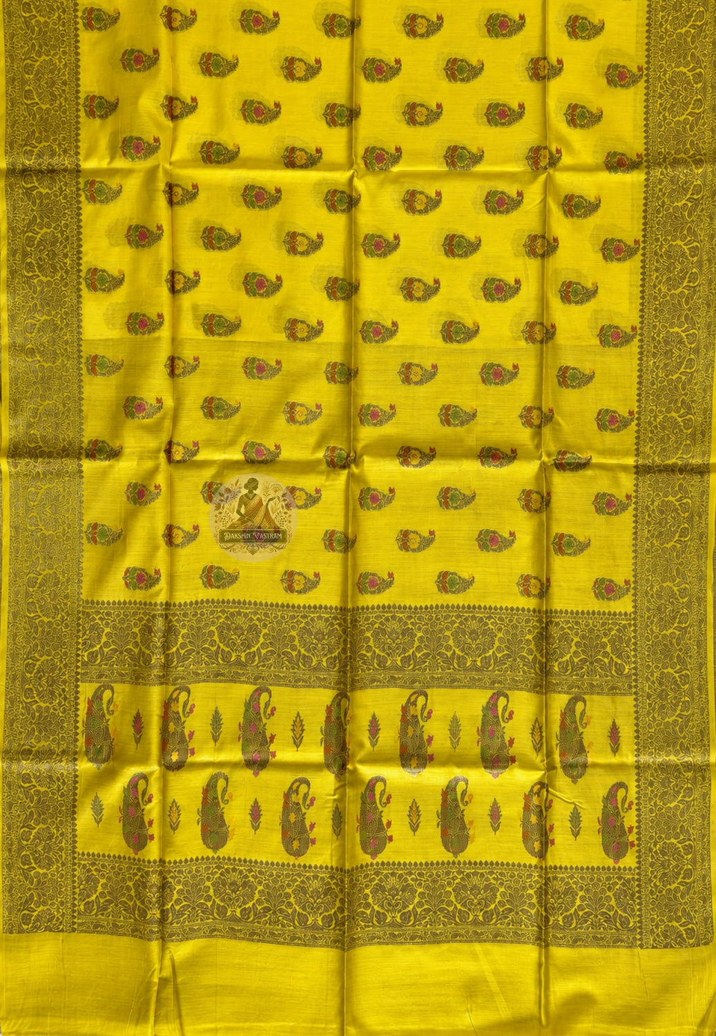 Close-up of pure Muga Tussar silk fabric of Banarasi Saree showing naturally golden wild silk texture and dense handwoven Banarasi weave