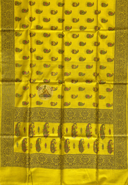 Close-up of pure Muga Tussar silk fabric of Banarasi Saree showing naturally golden wild silk texture and dense handwoven Banarasi weave