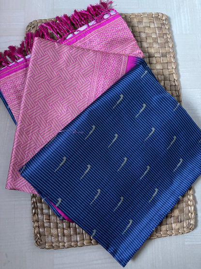 Pink and blue patterned cloths on a woven mat