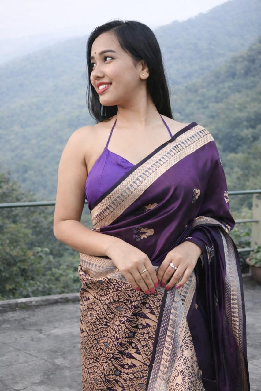 South Asian woman wearing Assam silk saree with junbiri necklace – handloom Indian saree UK	