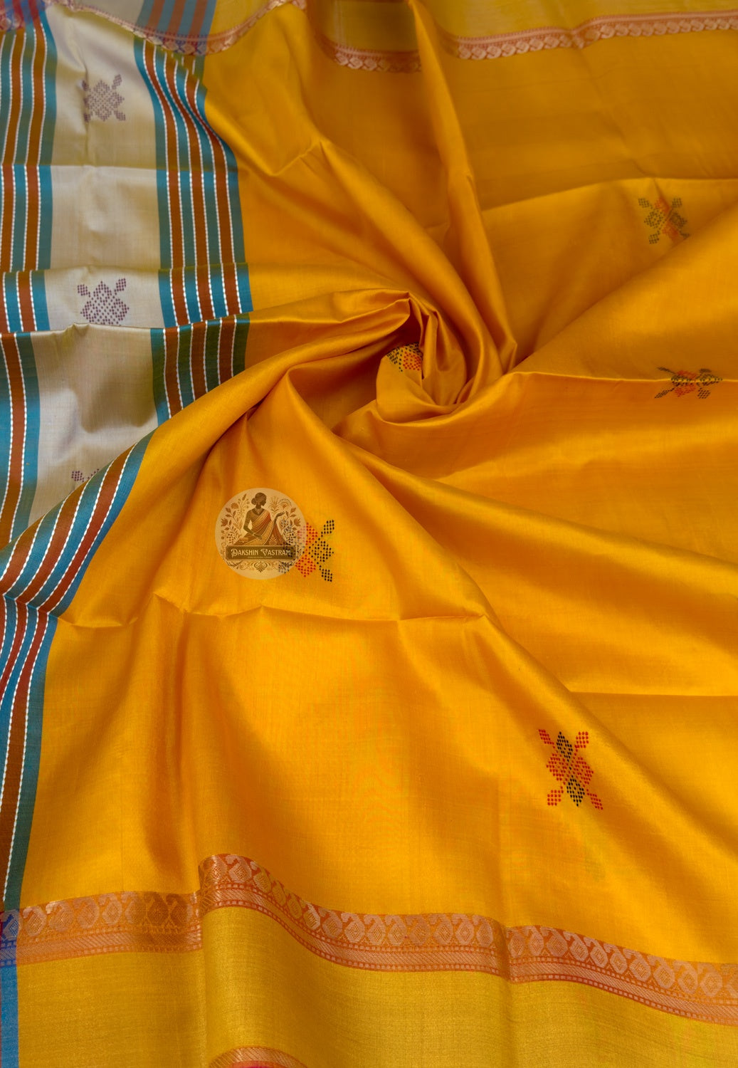 Close-up of master-woven Radha Krishna temple panel with zari creeper scroll detail on Bishnupur Katan Silk Saree