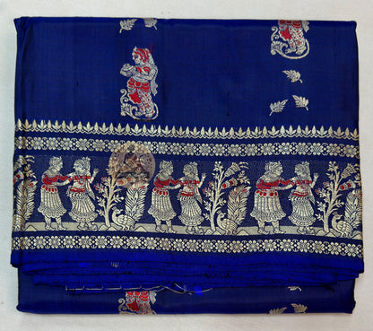 Close-up of pure silk fabric of Bishnupur Baluchari Saree showing natural lustrous sheen and fine handwoven texture of traditional Bengal silk