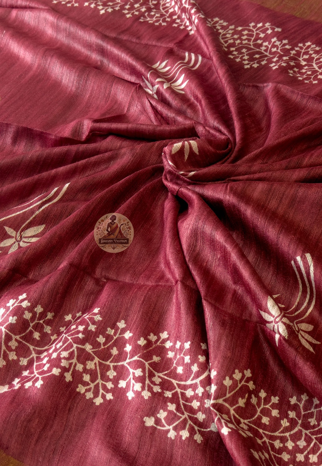 Close-up of Ghicha Tussar Silk weave showing characteristic slubs and natural texture — each thread handwoven by artisans from Jharkhand and Bihar