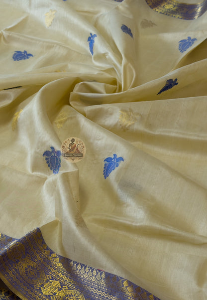 Flat lay of handwoven Tussar silk slub saree from Jharkhand showing natural earthy gold body, traditional border and wild silk texture detail — Dakshin Vastram