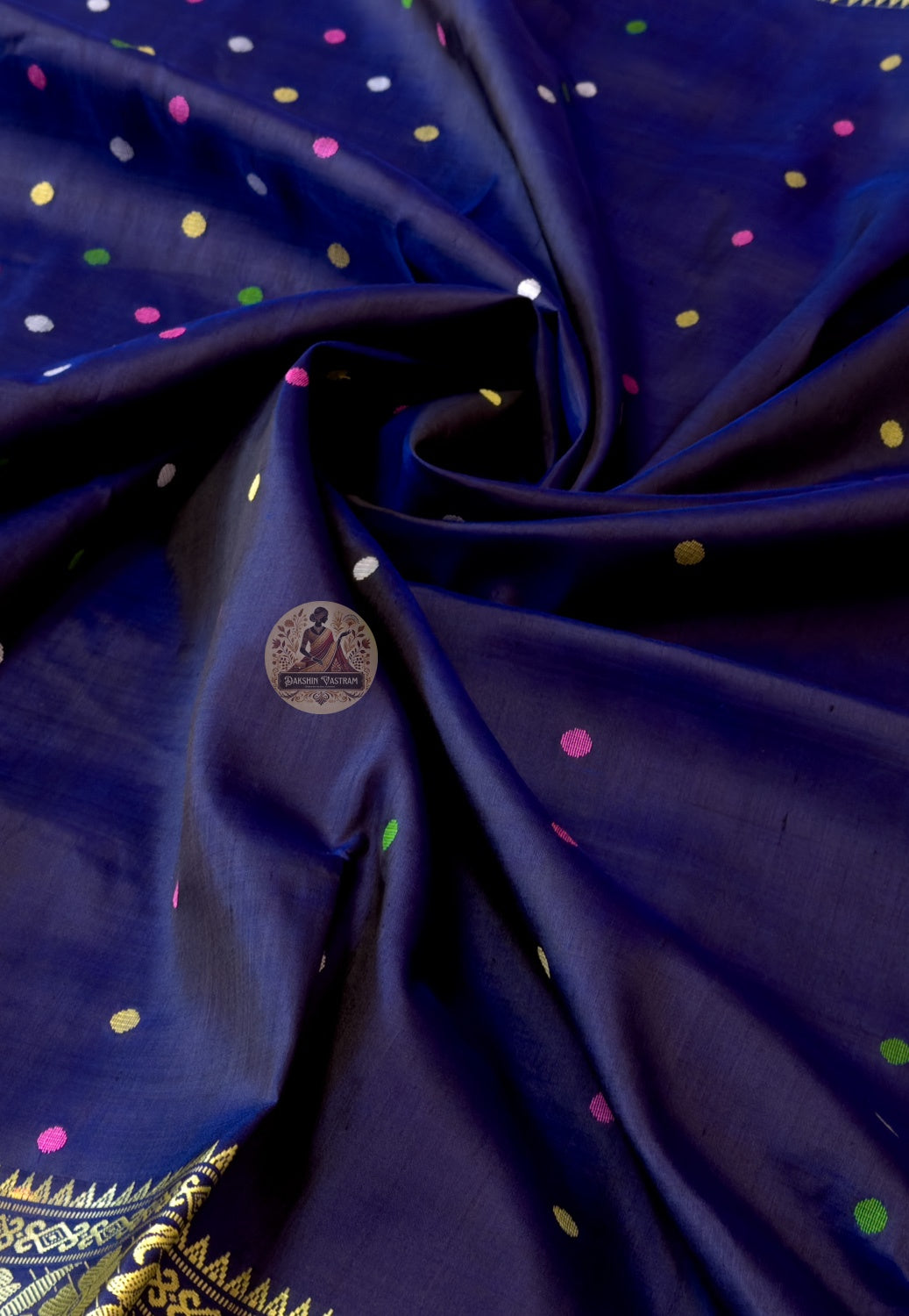 Close-up of Bishnupuri handwoven katan silk weave – pure mulberry silk lustre blazing under festival lights, intricate Bengal temple motifs woven permanently into the fabric